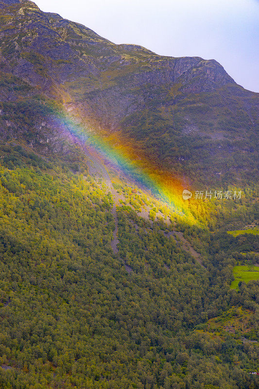 The end of the rainbow on the side of a Norway mountain.